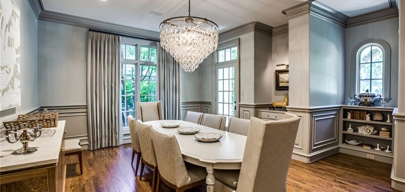 Dining Room With Rectangular Table And Crystal Chandeliers