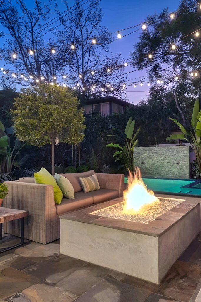 Modern Backyard Design With Concrete Fire Pit And Lights