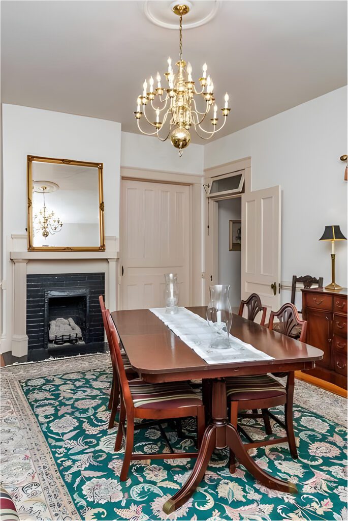 Traditional Dining Room Table in Front of a Fireplace"